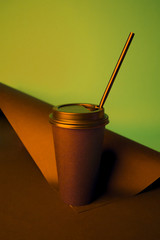 Black Coffee to go cup in vibrant bold gradient holographic colors. Concept art. Minimal hipster surrealism close up, coffee take away concept