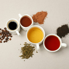 Time for a coffee break or teatime. Many different mugs and white cups  containing freshly brewed coffee, cocoa and tea for a daily dose of caffeine to energize day.