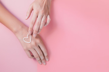 hand cream. like a heart. the concept of skin care, hydration and nutrition. manicure, soft hands,...