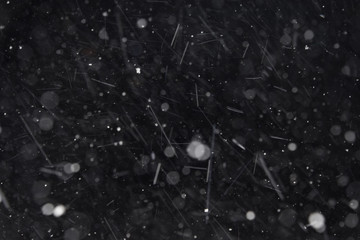 Snow falling close up with bokeh isolated