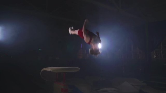 Gymnast gymnastic somersault exercise HD slow-motion video. Athlete salto