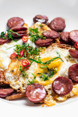 spicy chorizo sausage and eggs spanish huevos rotos tapas snack