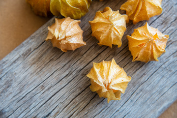 cape gooseberry fruit on wood texture.