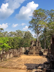 Fototapeta na wymiar Ta Prohm the temple ruins overgrown with trees at Angkor Wat in Seam Reap City, Cambodia in 2012 , 9th December.