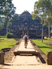 Ta Prohm the temple ruins overgrown with trees at Angkor Wat in Seam Reap City, Cambodia in 2012 ,...