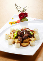 Delicious Chinese cuisine, fried beef with green onions