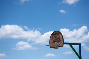 Basketball rim with cloudy background