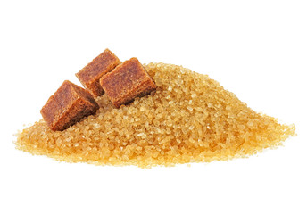 Brown sugar cubes and crystal sugar on white background