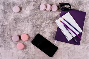 Wedding, St. Valentine's Day, birthday, preparation, holiday. Beautiful pink tasty macaroons on a concrete background