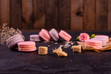 Wedding, St. Valentine's Day, birthday, preparation, holiday. Beautiful pink tasty macaroons on a concrete background