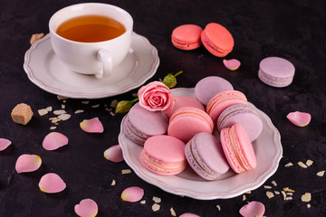Wedding, St. Valentine's Day, birthday, preparation, holiday. Beautiful pink tasty macaroons on a concrete background