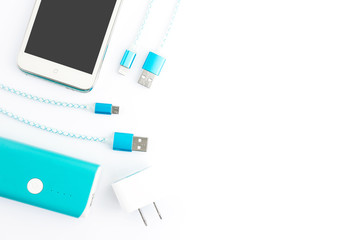 USB charging cables with smartphone and battery bank in top view