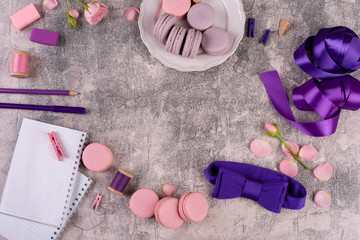 Wedding, St. Valentine's Day, birthday, preparation, holiday. Beautiful pink tasty macaroons on a concrete background
