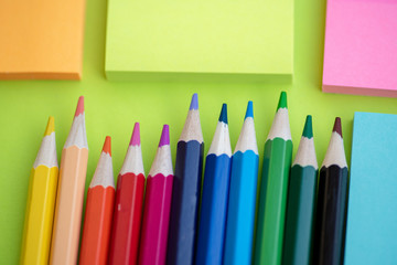 Color pencils against green background