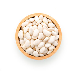 White beans in wood bowl isolated on white background