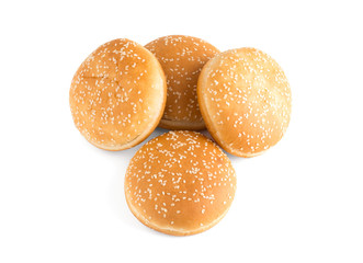 Burger buns on white background. A few buns cut in half close up on a white background.