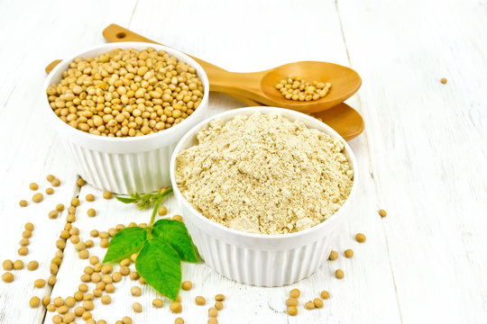 Flour soy with soybeans and leaf on board