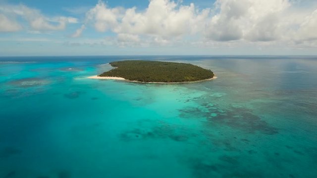 aerial footage tropical island with beach and palm trees lagoon with turquoise water Sea tropical landscape Daco island, Philippines, Siargao. Travel concept Aerial video