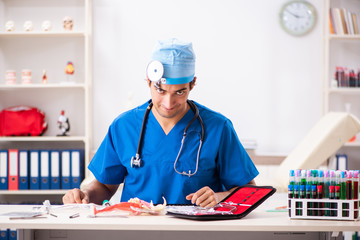 Mad doctor working in the clinic 