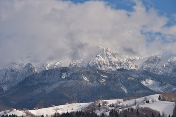 Fototapeta na wymiar Beautiful day of winter on magical wild Transylvania mountain hills.