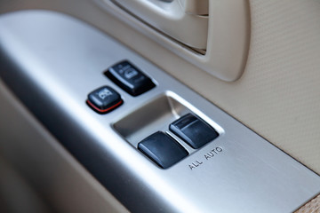 Control buttons for automatic opening of car windows and central locking on a vehicle door