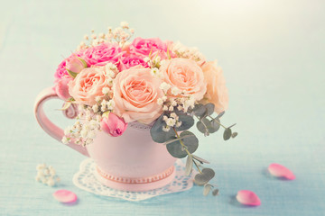Pink roses in a teacup
