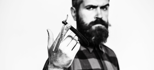 Straight razor, barbershop, beard. Barber scissors. Mens haircut. Man in barbershop. Bearded man, lush beard, handsome. Hipster, brutal male. Barber shop. Vintage straight razor. Black and white