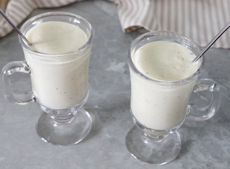 Fresh blended  kiwi protein smoothie with yogurt or milk in glass jar, healthy eating