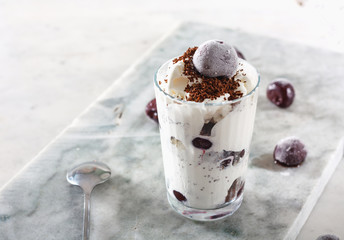 Ice cream with cherry berries on  marble countertop background