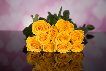 Bouquet of yellow roses on a black background. Valentine's Day