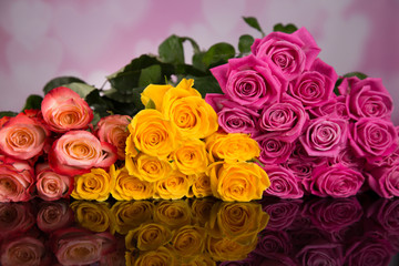 A bouquet of colorful roses on a black background for Valentine's Day