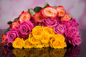 A bouquet of colorful roses on a black background for Valentine's Day