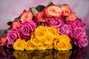 A bouquet of colorful roses on a black background for Valentine's Day