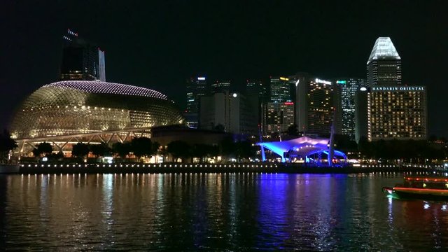 City skyline with Esplanade theatre and bridge with Singapore river embankment at night in Marina bay, Singapore