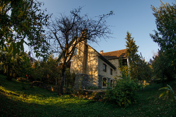 Beautiful landscape village house with trees at the forest during autumn, Azerbaijan