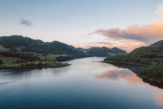 a lake in Norway with beautiful sunrise in background