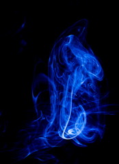 Blue smoke on black background