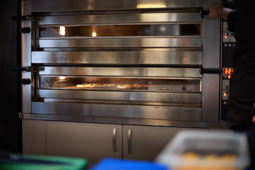 Delicious Pizza with a lot of ingridients baked in the oven