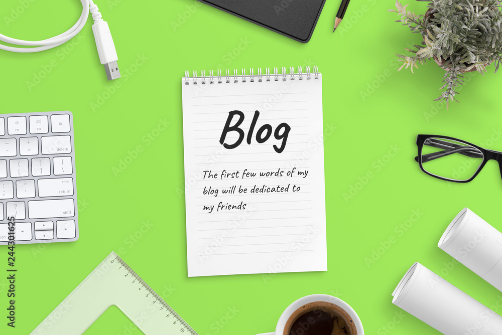 Poster blog post text on notepad surrounded with office supplies. green background, top view, hero, header 