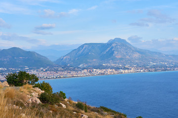 Sea coast of Alanya/ Antalya, Turkey with mountains and clouds on sky.