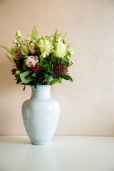 Bunch of elegant flowers in vase as love or Valentines day attribute