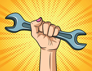 Color vector illustration in pop art style. Female hand with spanner on yellow halftone background. Horizontal poster for the International Labor Day. Women's rights, female power, discrimination