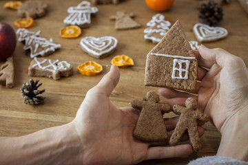 Christmas gingerbread icing decorating process. Homemade sweet cookies