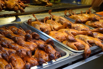 Grilled little ducks at a local Chinese market in Beijing
