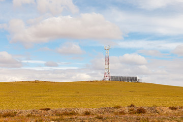 Fototapeta na wymiar tower of cellular communication with solar panels in the steppe, Mongolia