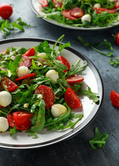 Chorizo salad with cherry tomatoes, mozzarella and wild rucola
