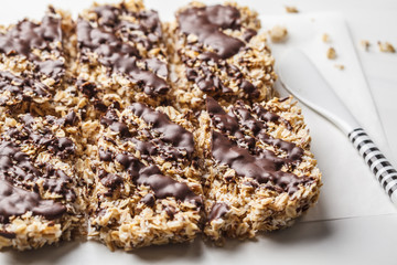 Homemade chocolate oat bars on a white background. Healthy vegan dessert, detox food