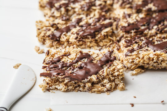 Homemade chocolate oatmeal bars on a white background. Healthy vegan dessert, detox food