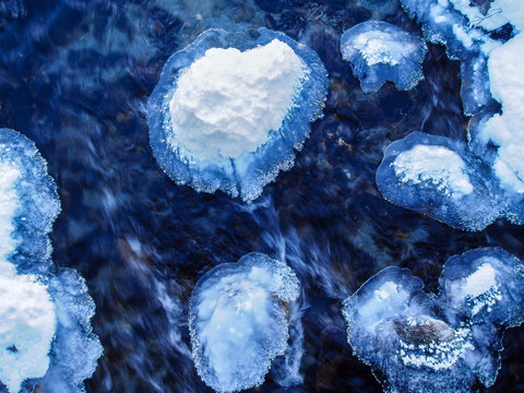 Floes in a dark blue mountain creek on an ice cold winter day in Switzerland - Powered by Adobe