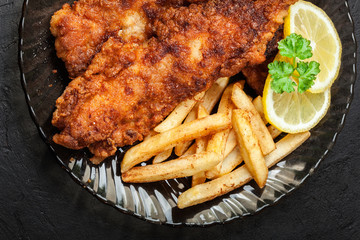 Fried fish in crispy batter with chips